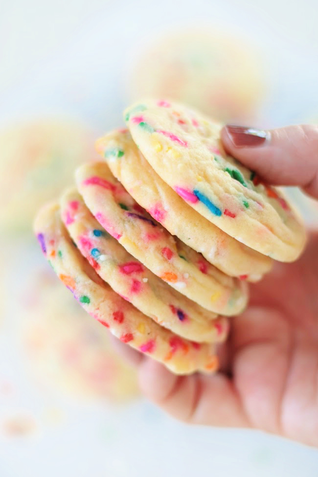 hand holding 5 sugar cookies