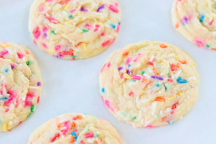 sprinkle drop sugar cookies on parchment paper