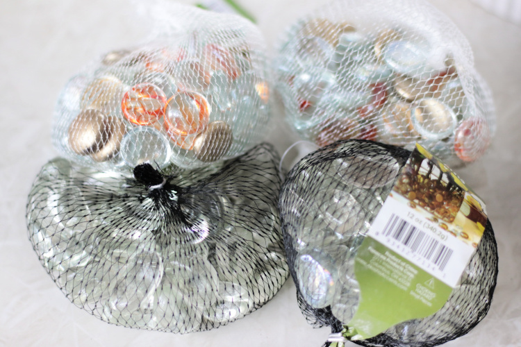 four bags of clear glass rocks