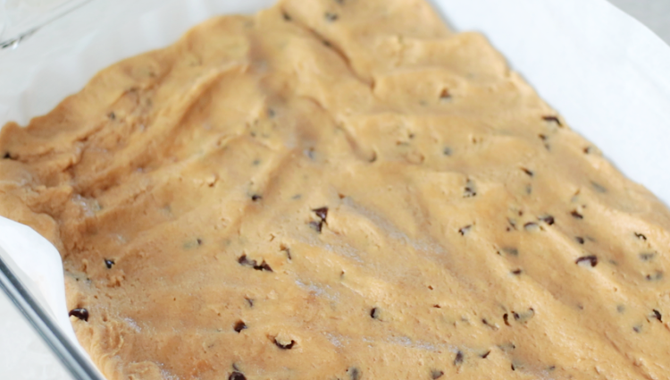 unbaked peanut butter cookie dough in baking pan