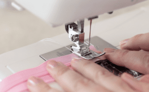 sewing machine stitching end of zipper