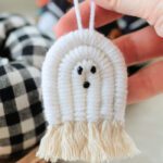 hand holding white macrame ghost