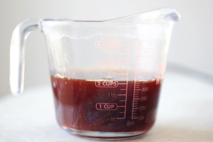 boiled cider in a glass measuring cup