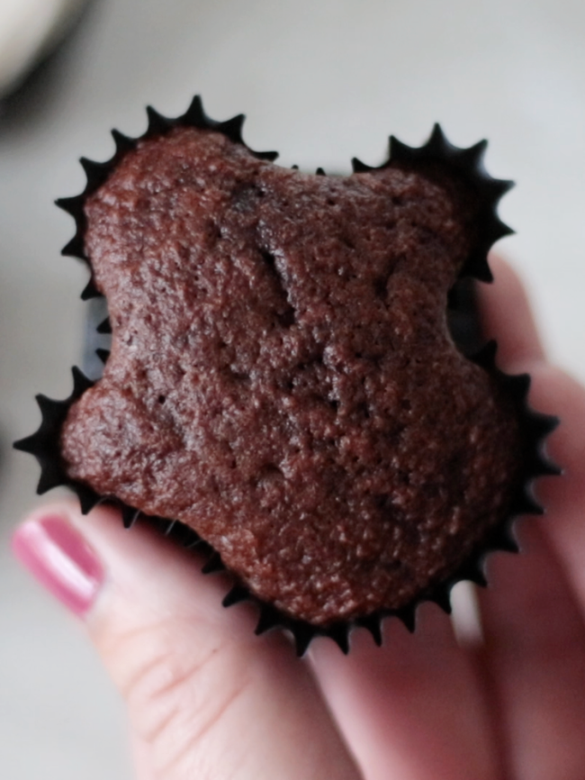 unfrosted chocolate cupcake shaped like a ghost