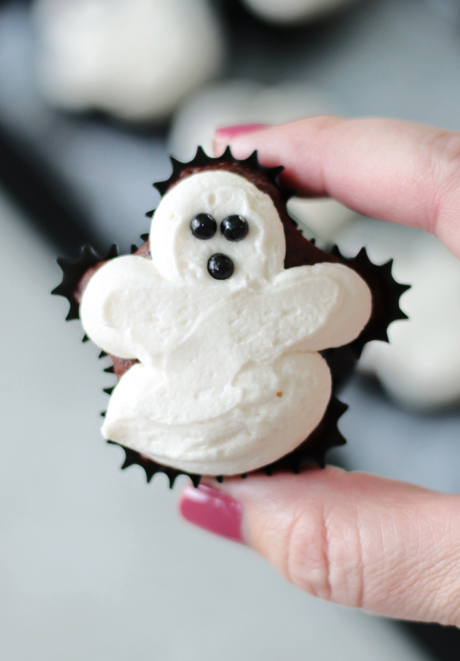 hand holding ghost cupcake
