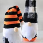 Two sock gnomes on a table.