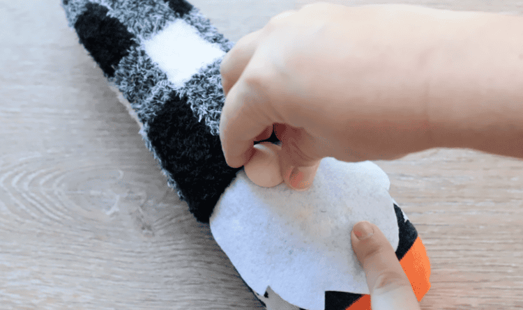 Wooden bead glued to front of gnome.