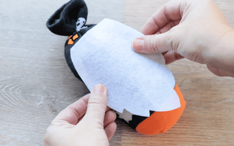 Felt beard glued onto front of gnome.