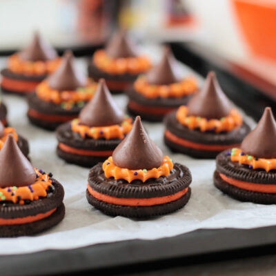 witch hat cookies on black platter