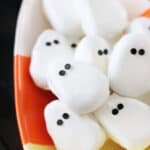 Candy corn-shaped bowl of copycat Reese's peanut butter ghosts.