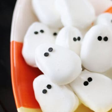 Candy corn-shaped bowl of copycat Reese's peanut butter ghosts.