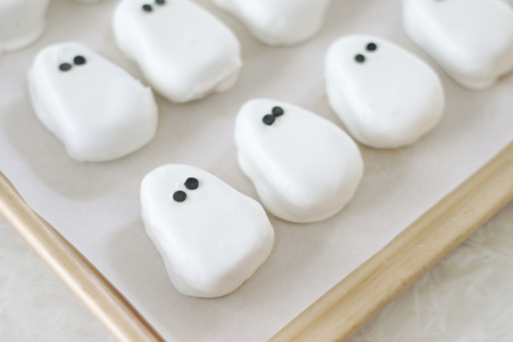 white chocolate ghosts on baking sheet