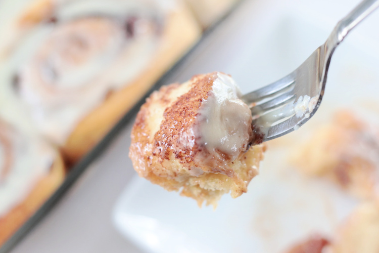 bite of cinnamon roll on a fork