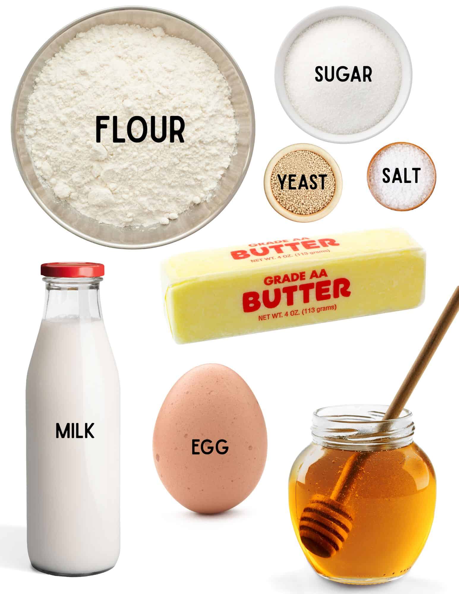 Bowle of flour, sugar, yeast, salt, bottle of milk, egg, honey and stick of butter.