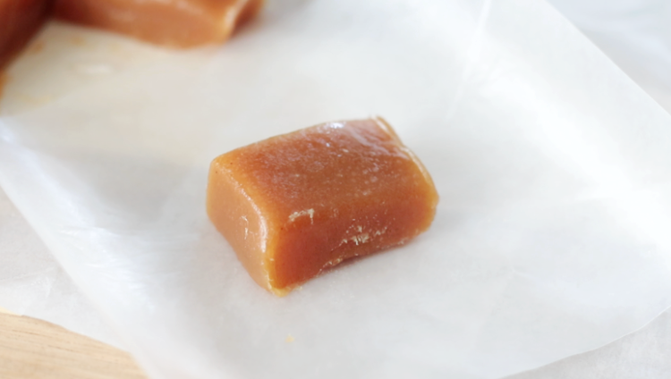 square of caramel on a piece of wax paper