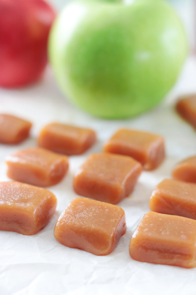 squares of caramels near two apples