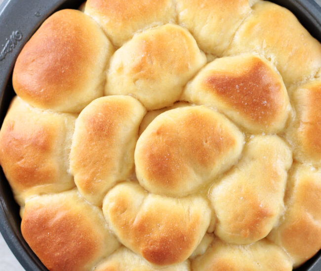 pan of Parker house rolls brushed with butter