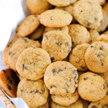 Basket of mini pumpkin chocolate chip cookies.