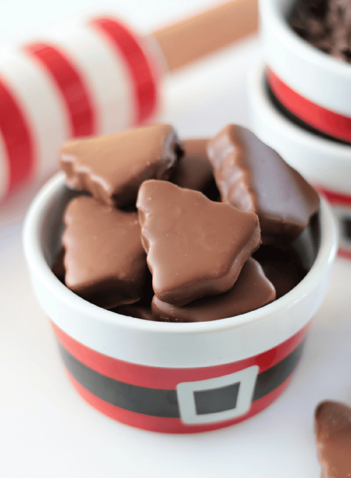 Chocolate peanut butter trees in holiday bowl.