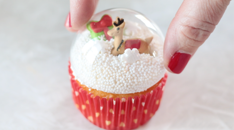 plastic Christmas ornament on top of cupcake