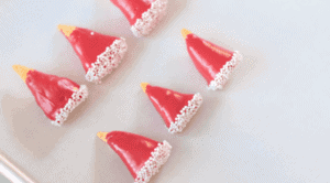 bugles dipped in red candy melts and white sprinkles