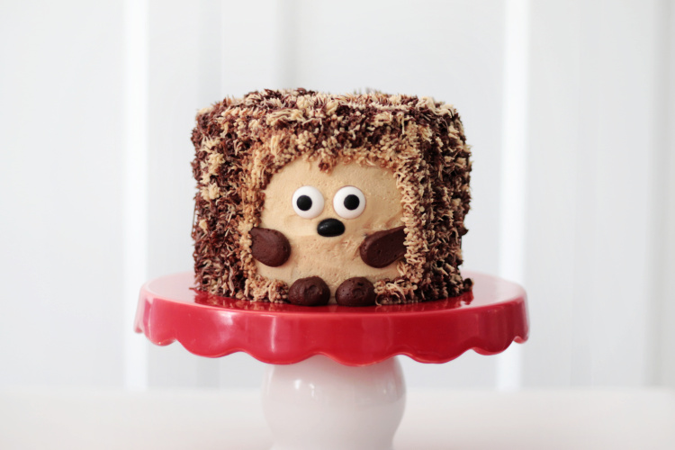 hedgehog cake on red cake stand