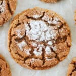 Molasses cookie on parchment paper.