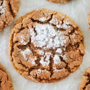 Molasses cookie on parchment paper.