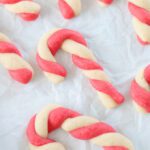 candy cane sugar cookies on parchment paper