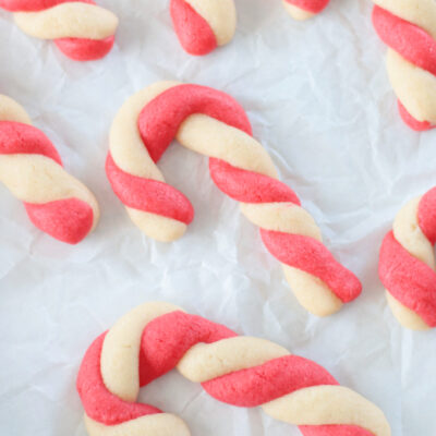 candy cane sugar cookies on parchment paper