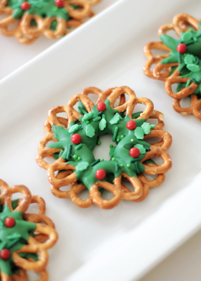 chocolate pretzel wreaths on a white platter