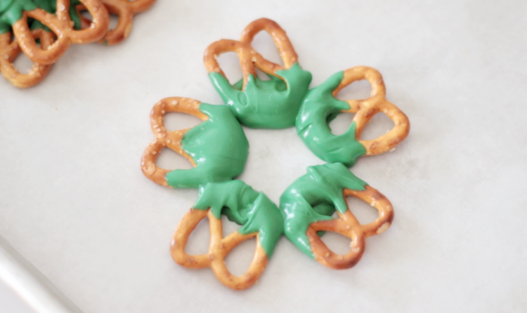 five pretzels dipped in green chocolate
