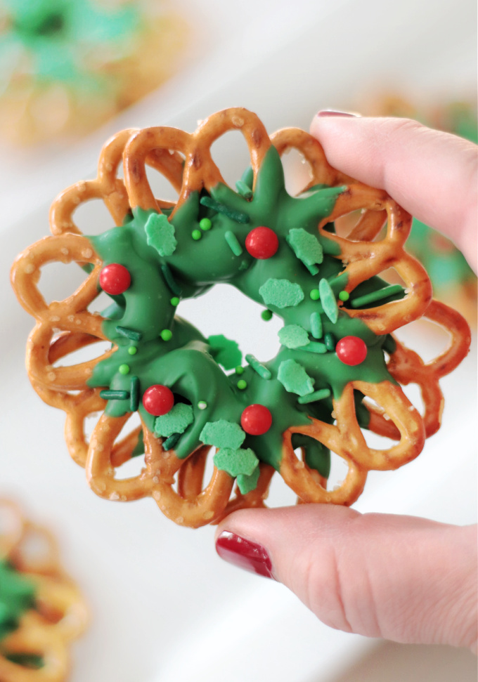 hand holding pretzel wreath