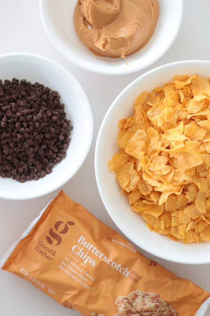 bowls of corn flakes, chocolate chips, peanut butter and butterscotch chips