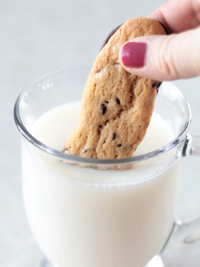 cup of milk with cookie dunkers dipped in milk