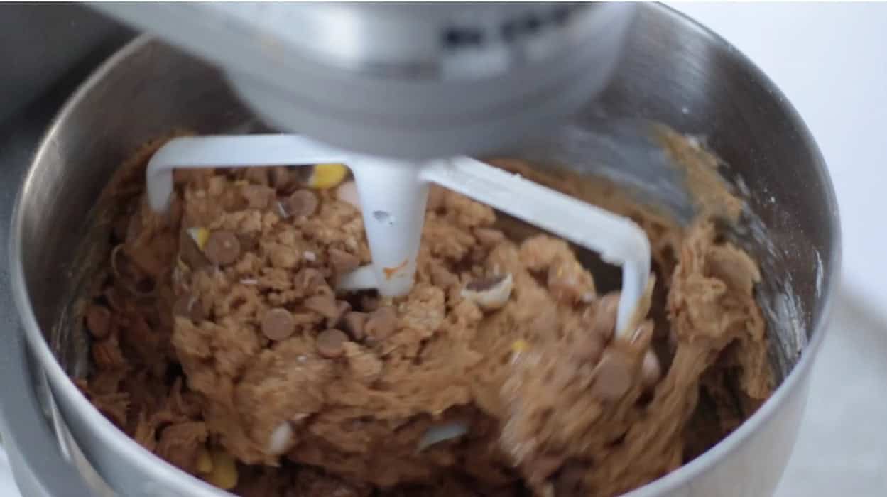 Cadbury peanut butter cookie dough in stand mixer.