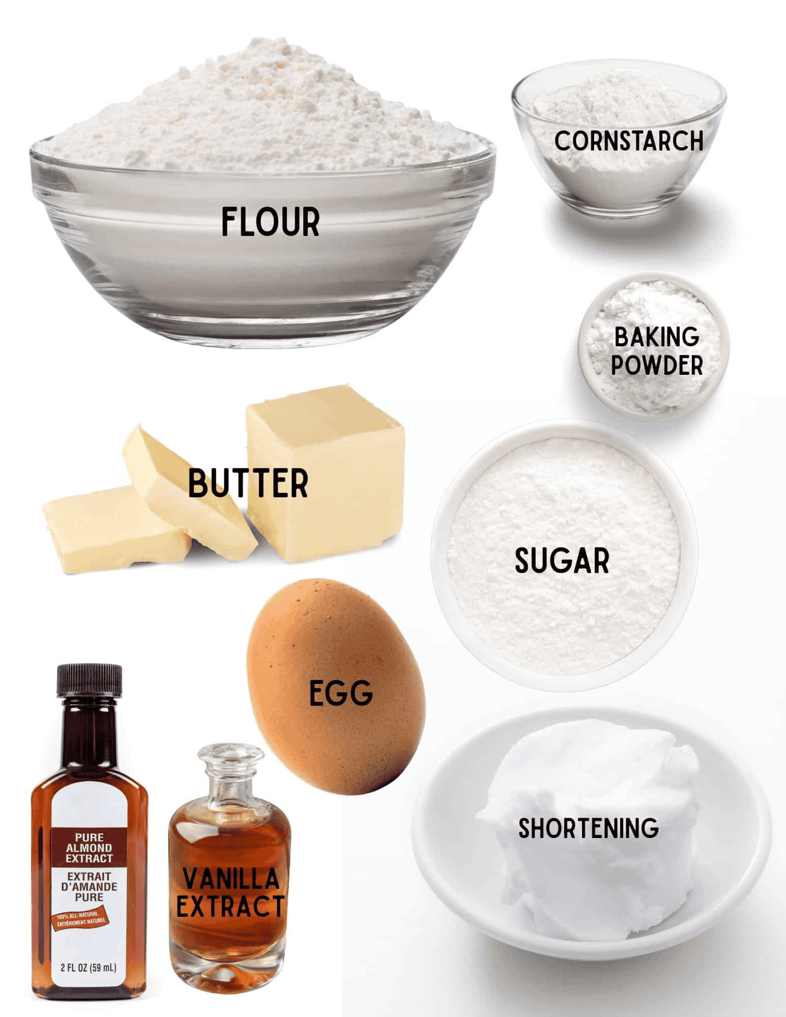 Bowls of flour, cornstarch, baking powder, sugar, stick of butter, egg, bottles of vanilla and almond extract,  and shortening.