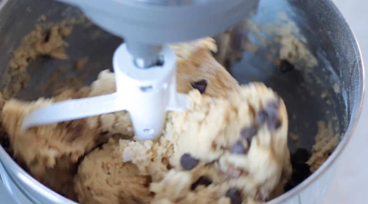 Stand mixer bowl of chocolate chip cookie dough.
