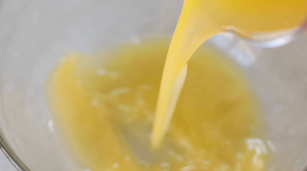 Glass bowl of melted butter.