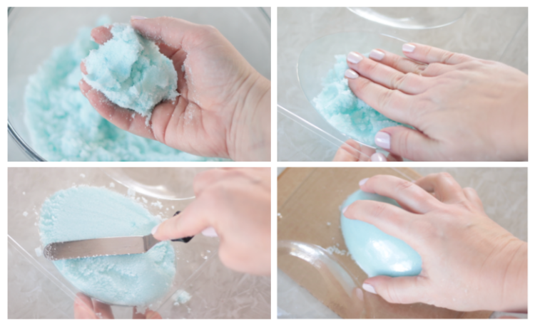 hand pressing wet sugar into the egg mold.
