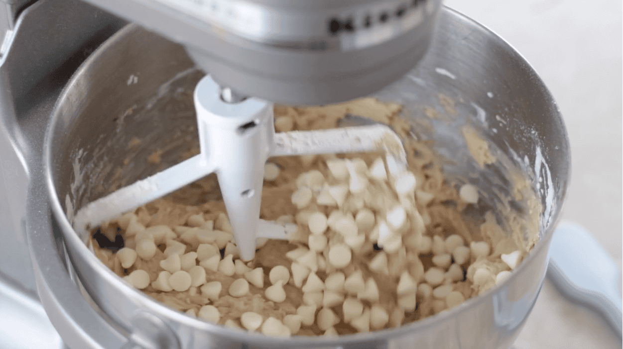 Metal stand mixer bowl of cookie dough.
