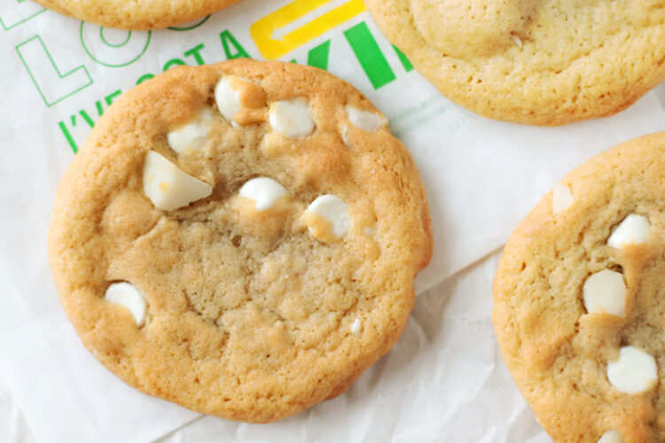 white chocolate macadamia nut cookies on parchment paper