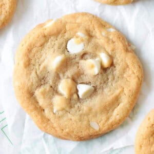 White chocolate macadamia nut cookies on parchment paper