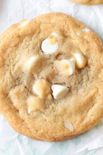 White chocolate macadamia nut cookies on parchment paper