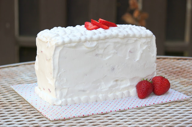 layered strawberry pound cake on cake board