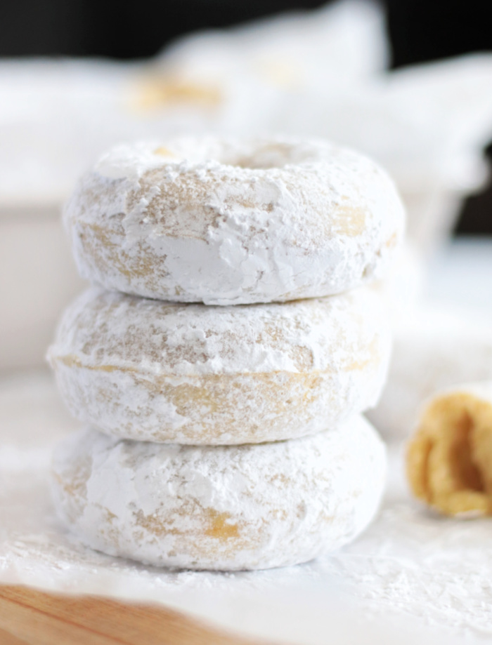 3 powdered sugar donuts stacked