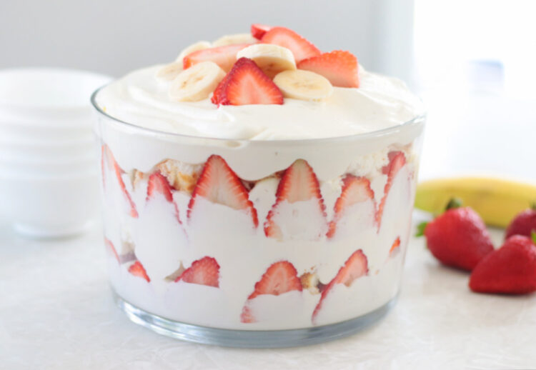 strawberry banana trifle layered in glass bowl