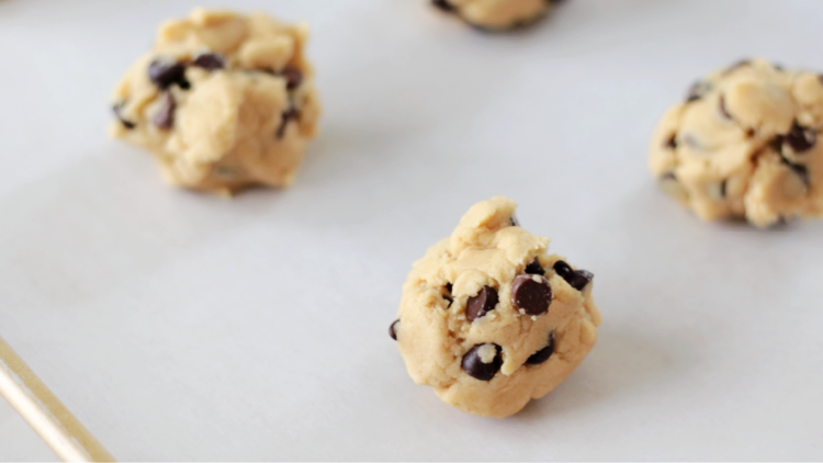 balls of cookie dough on baking sheet