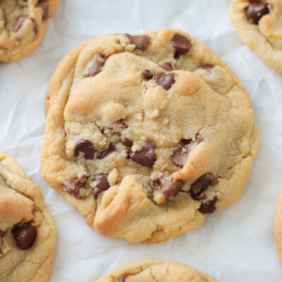 large chocolate chip cookie on parchment paper