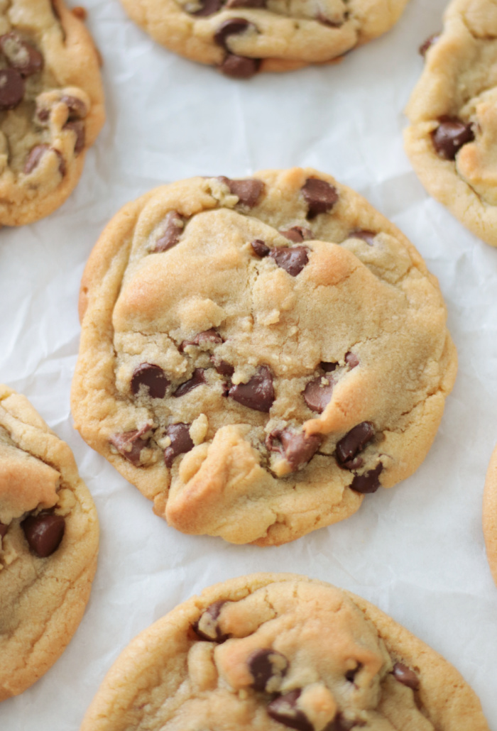 large chocolate chip cookie on parchment paper